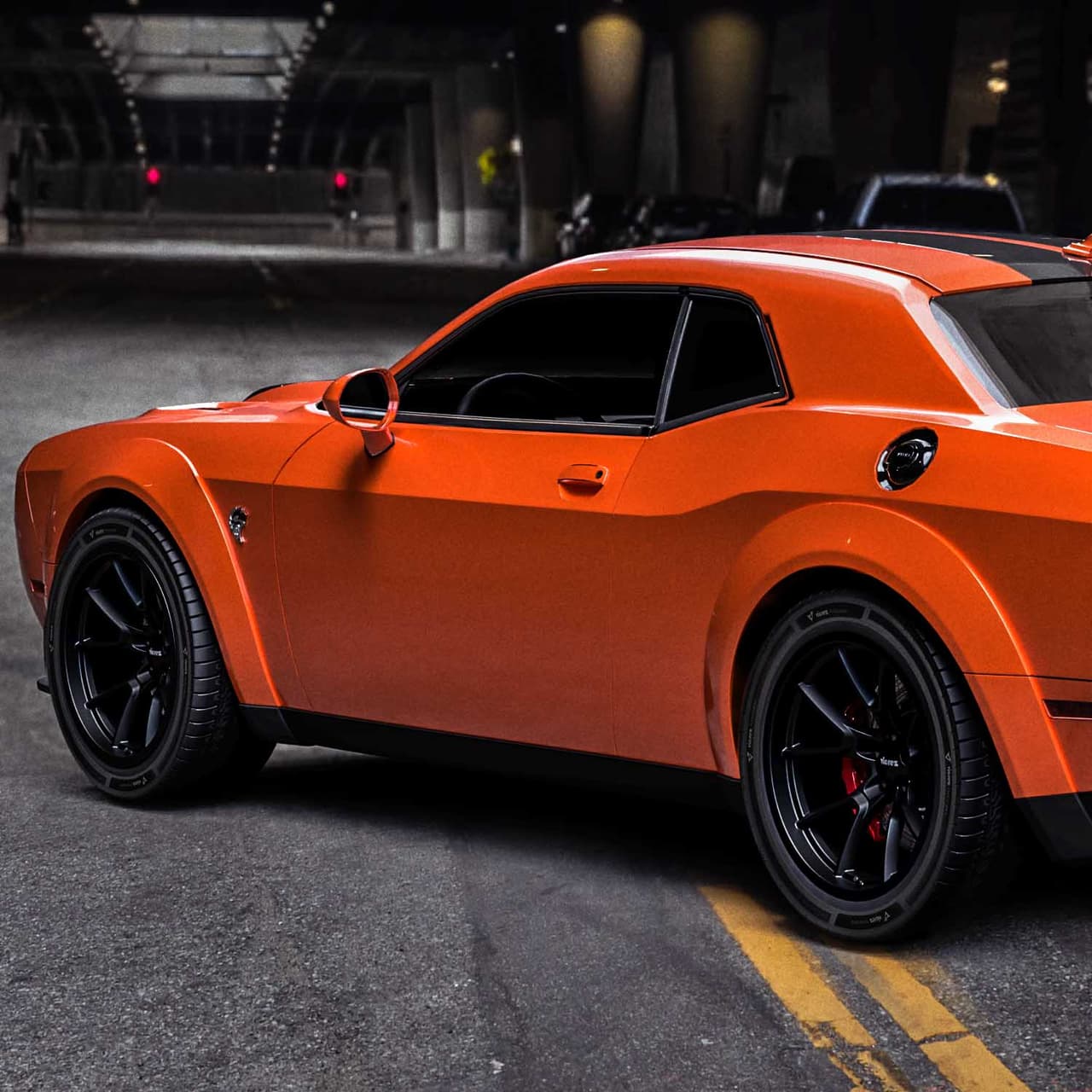 Orange Dodge Challenger with black Vicrez wheels