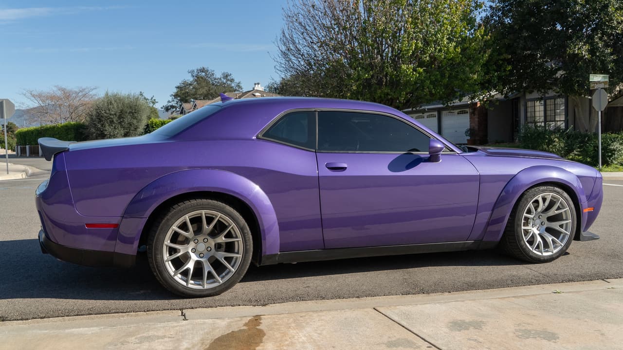 Purple Dodge Challenger with silver multi-spoke custom wheels