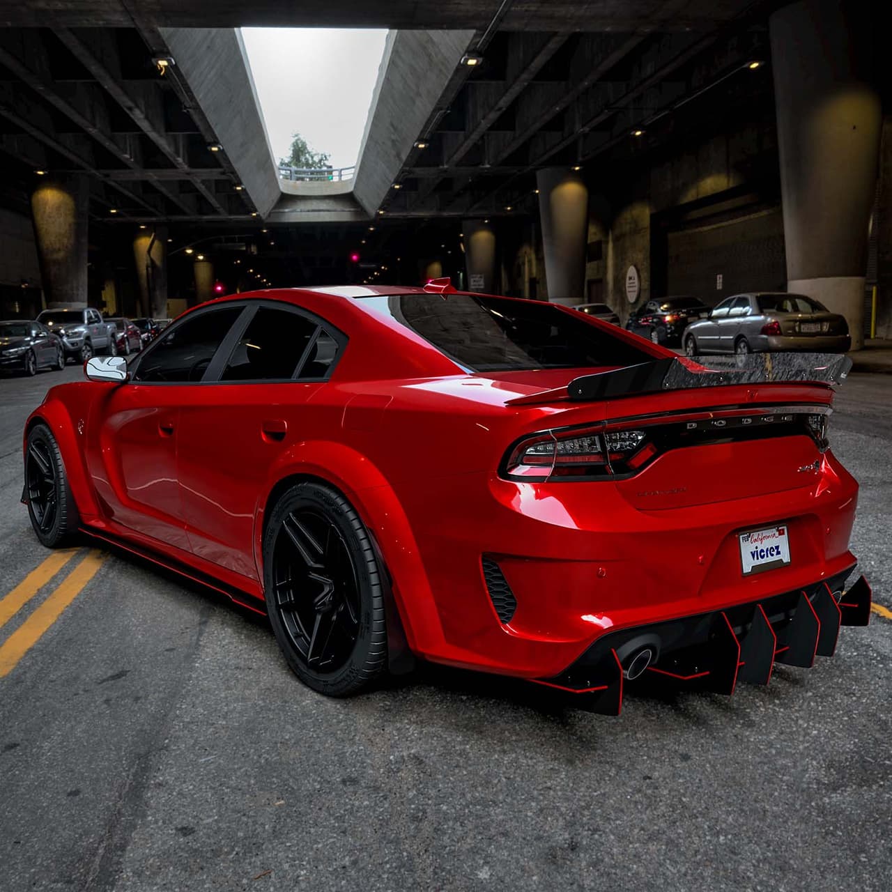 Red Dodge Charger showing its rear diffuser and exhaust layout