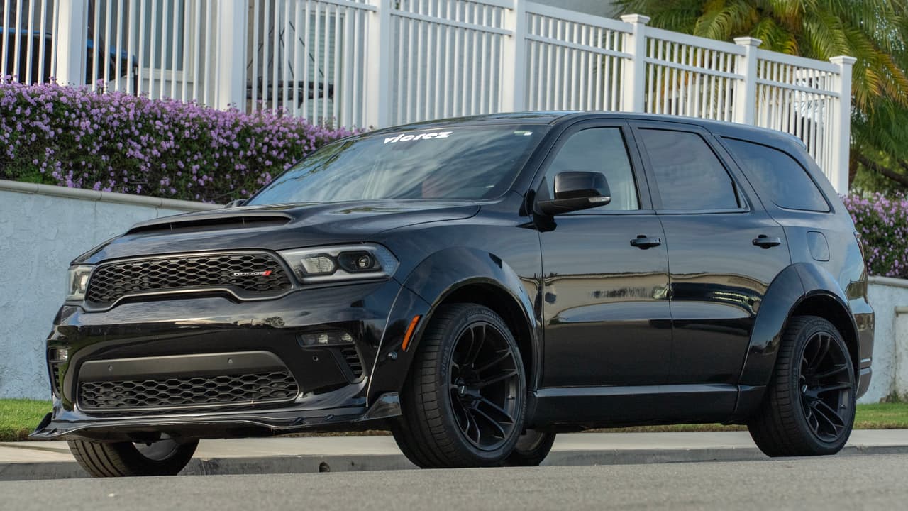 Black Dodge Durango showing Vicrez widebody front and rear fender flares