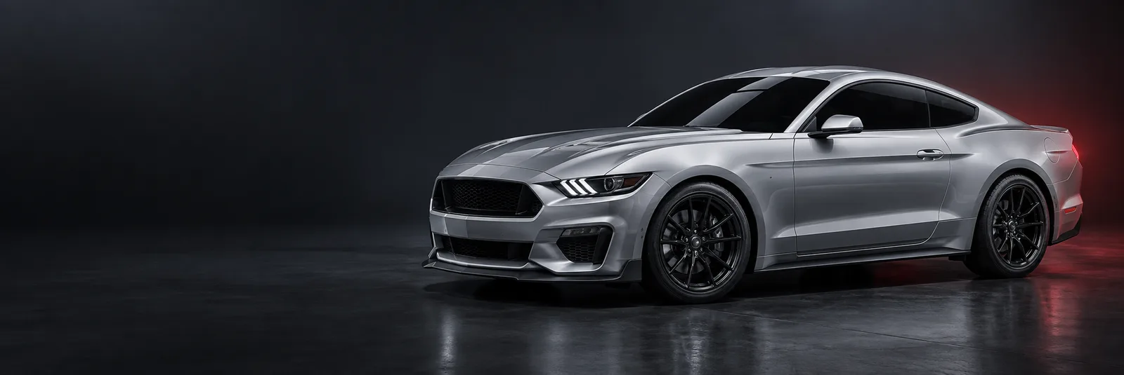 Silver performance coupe with dark tinted side windows in a studio